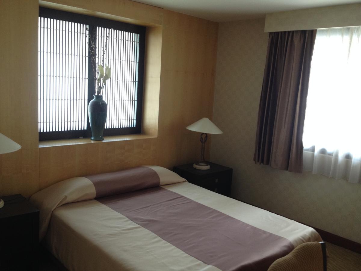 Gardengrove Suites Bangkok Rum bild